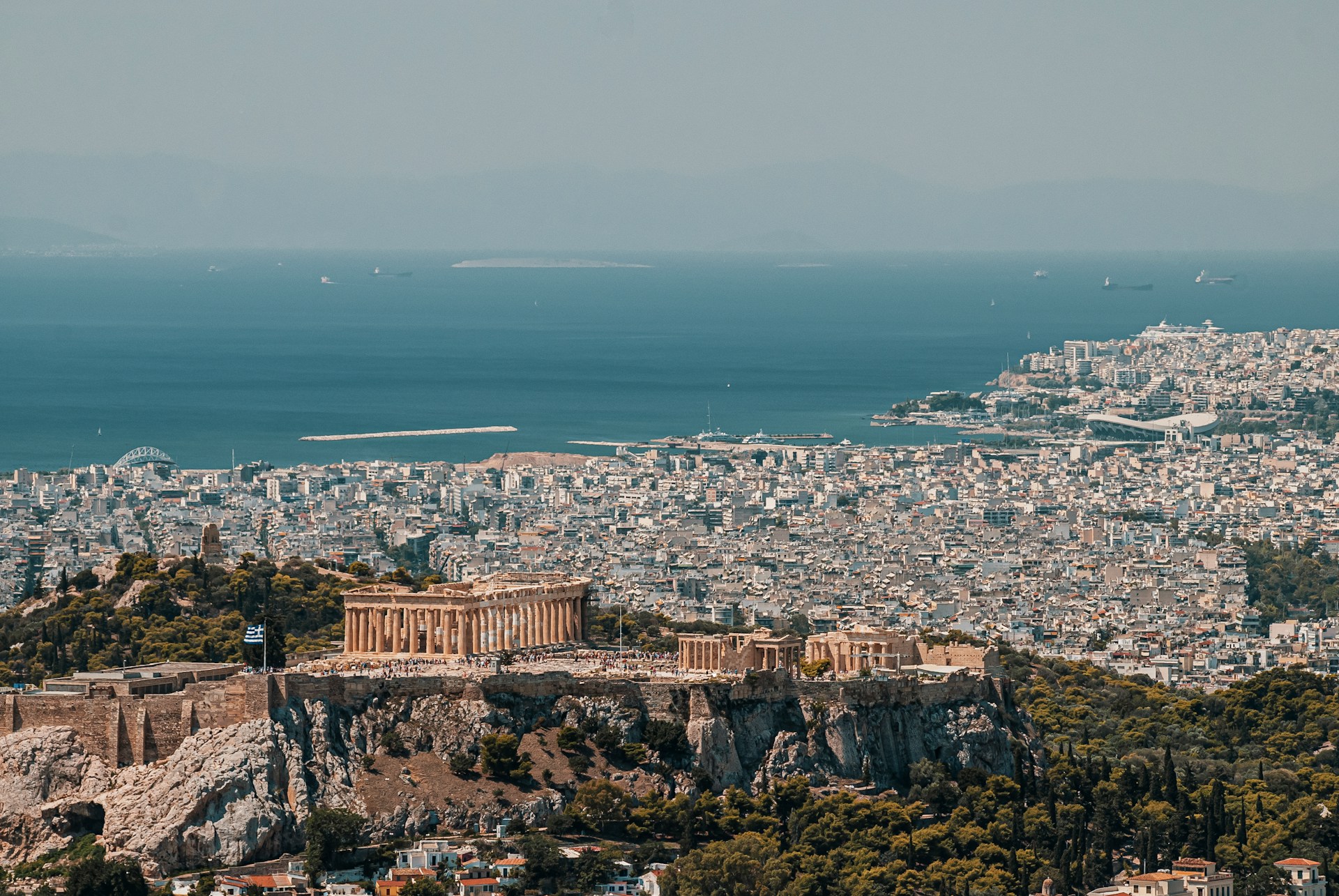The Acropolis above Athens, with the city and sea beyond.